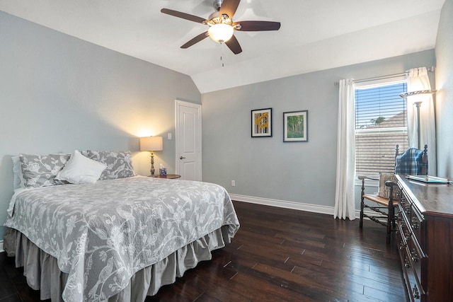 bedroom featuring baseboards, ceiling fan, dark wood-style flooring, and vaulted ceiling