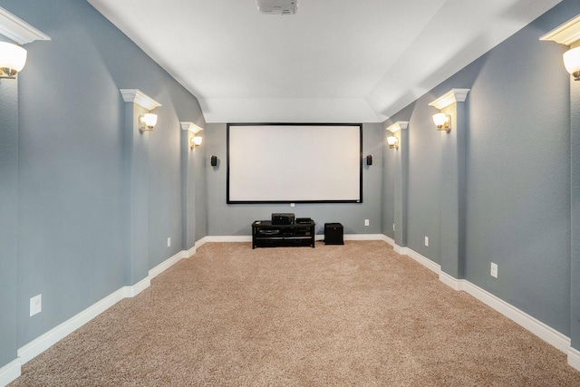 home theater room featuring carpet flooring and baseboards