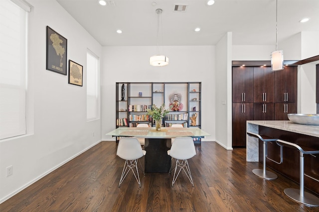 dining room featuring dark wood finished floors, recessed lighting, visible vents, and baseboards