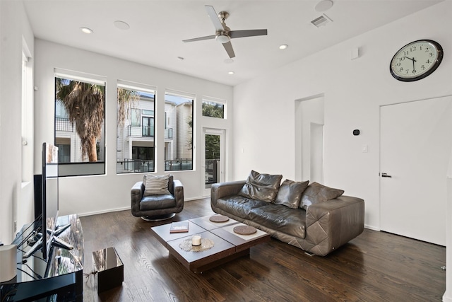 living area featuring a ceiling fan, wood finished floors, visible vents, baseboards, and recessed lighting