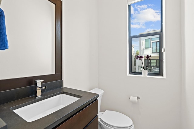 half bath with toilet and vanity