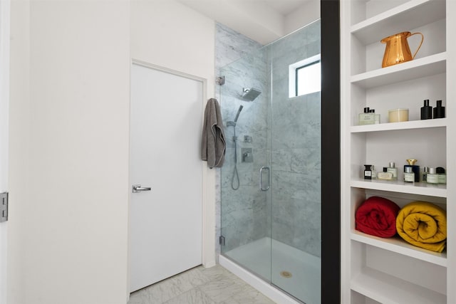 full bathroom with built in features, marble finish floor, and a stall shower