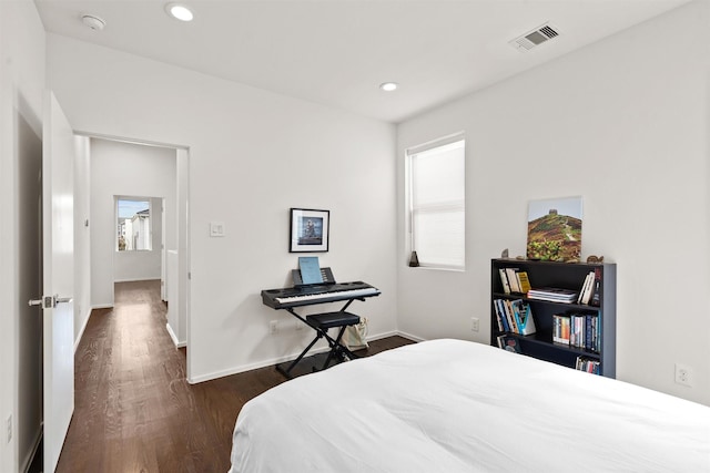 bedroom with recessed lighting, visible vents, baseboards, and dark wood-style floors