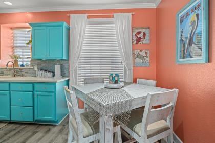 dining area with light wood-style flooring and crown molding