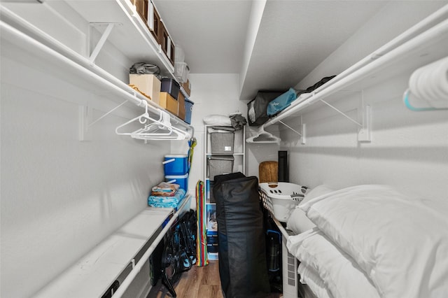 spacious closet with wood finished floors