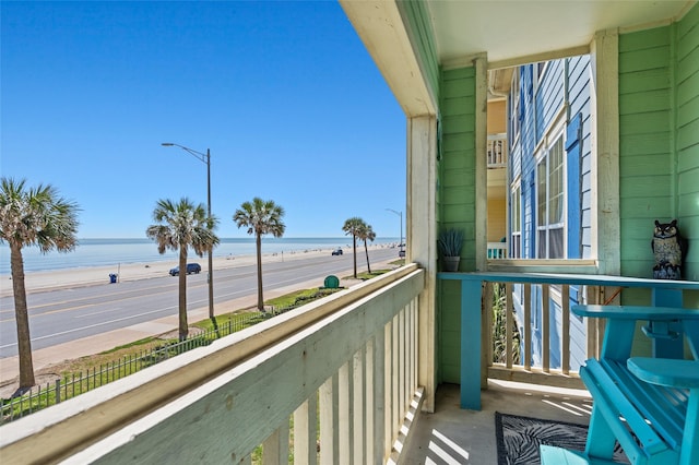 balcony featuring a water view