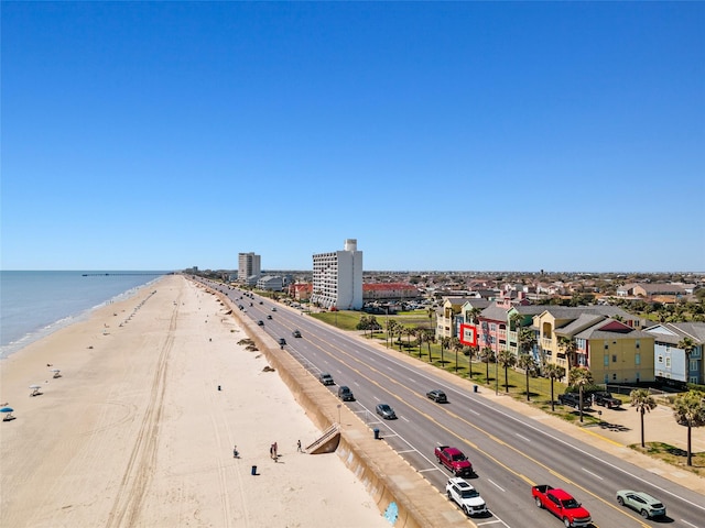 birds eye view of property with a view of the beach and a water view