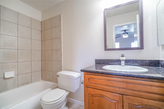 full bathroom with vanity, baseboards, a textured ceiling, tile patterned floors, and toilet