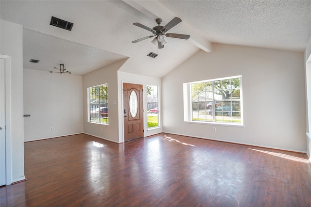 entryway featuring visible vents, a ceiling fan, lofted ceiling with beams, a textured ceiling, and wood finished floors