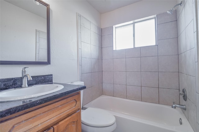 bathroom featuring shower / tub combination, vanity, and toilet