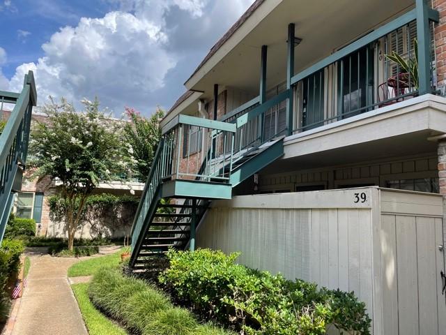 view of side of property with stairway