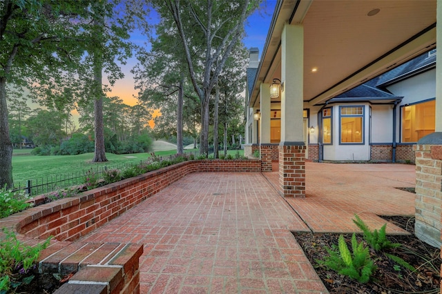 view of patio terrace at dusk