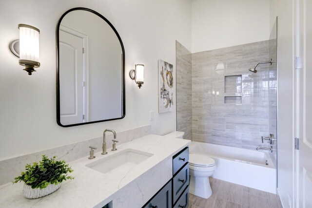 bathroom featuring vanity, toilet, and shower / bathtub combination