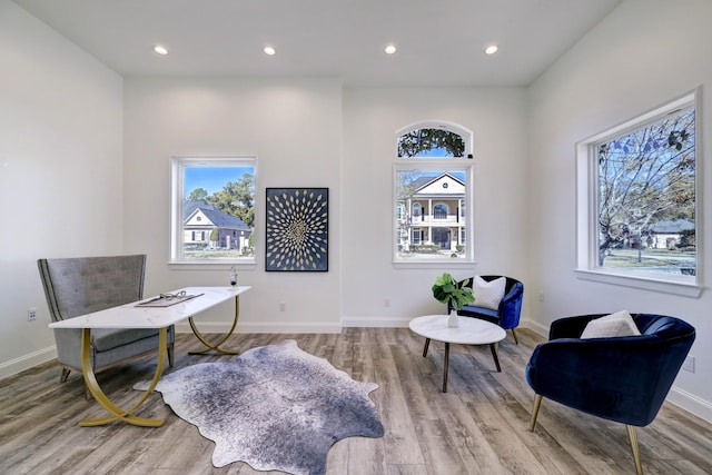 office space featuring recessed lighting, baseboards, and wood finished floors