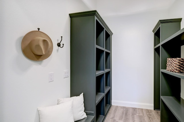 interior space with light wood-type flooring and baseboards