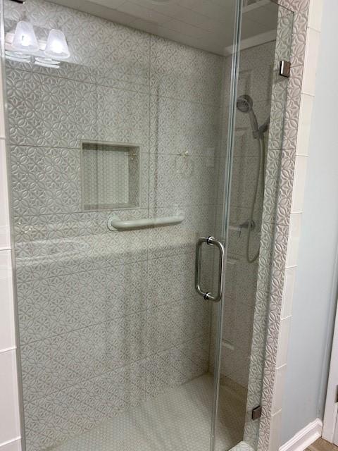 full bathroom with a shower stall