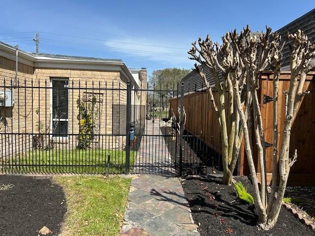 view of gate featuring fence