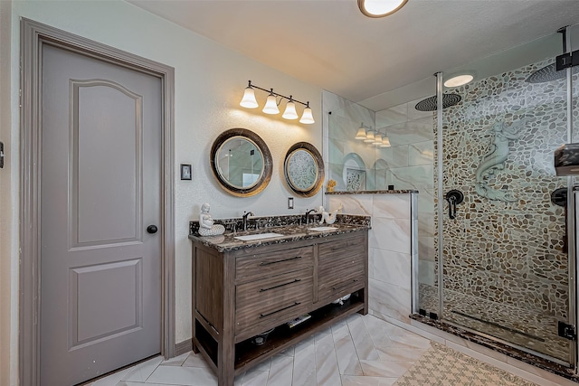 bathroom featuring a shower stall and vanity