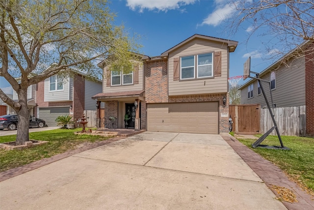 traditional-style house with brick siding, concrete driveway, a garage, and fence