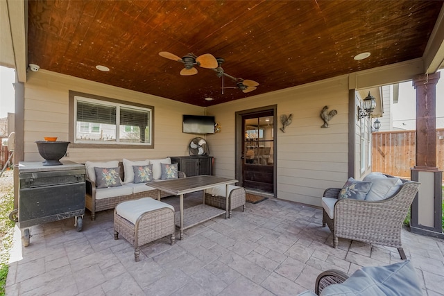 view of patio with outdoor lounge area and a ceiling fan