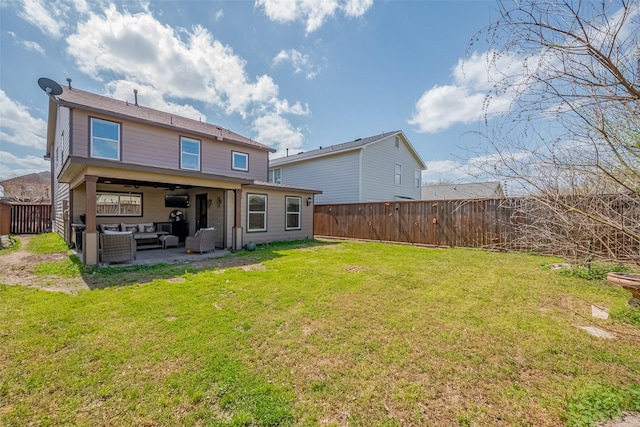 rear view of house with a lawn, an outdoor hangout area, a fenced backyard, and a patio