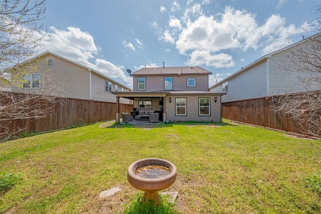 back of house with a yard, central air condition unit, a fenced backyard, and a patio area