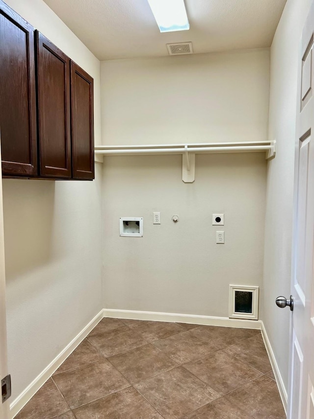 laundry area with visible vents, baseboards, hookup for a gas dryer, cabinet space, and electric dryer hookup