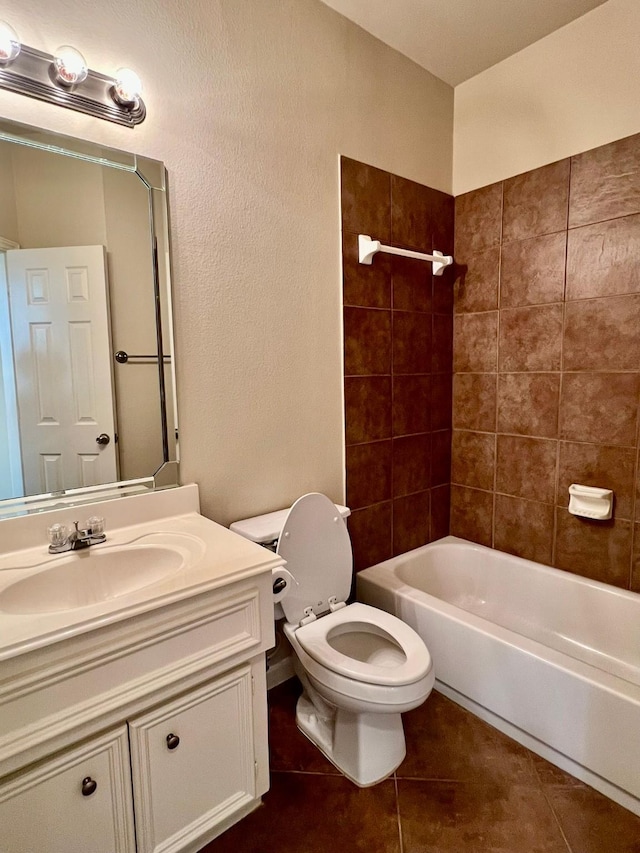 full bath featuring vanity, tile patterned floors, toilet, and tub / shower combination