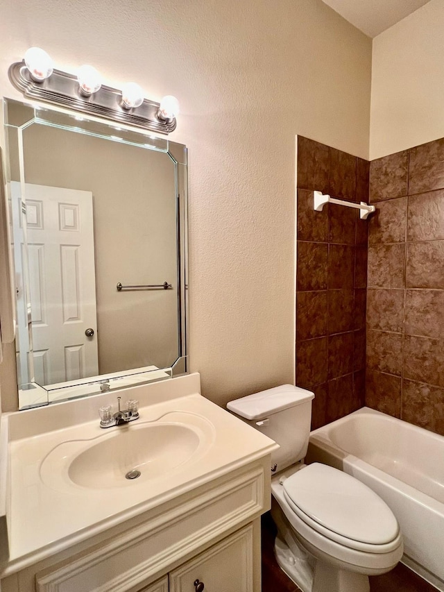 bathroom featuring shower / bath combination, toilet, and vanity