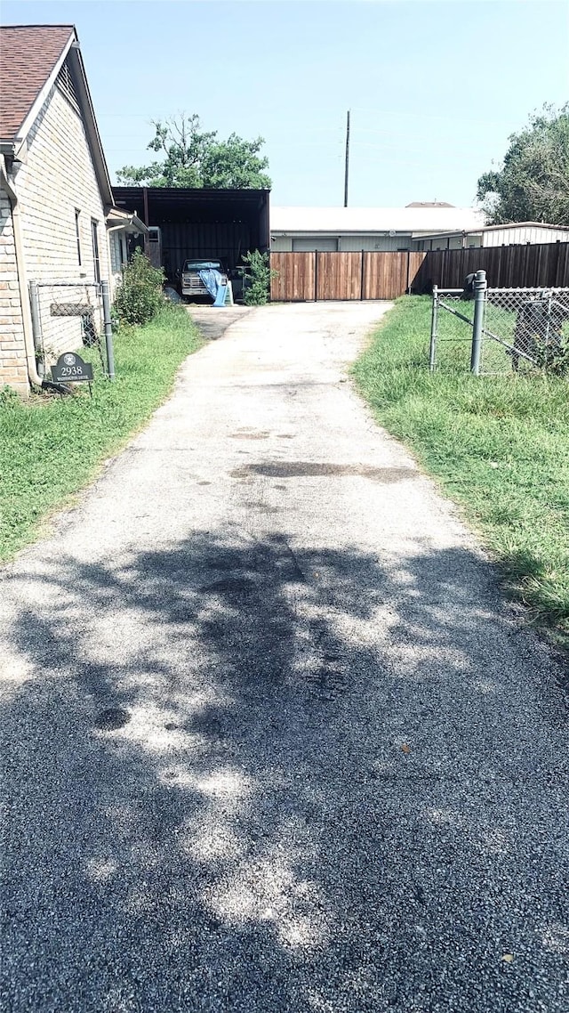 view of road with aphalt driveway