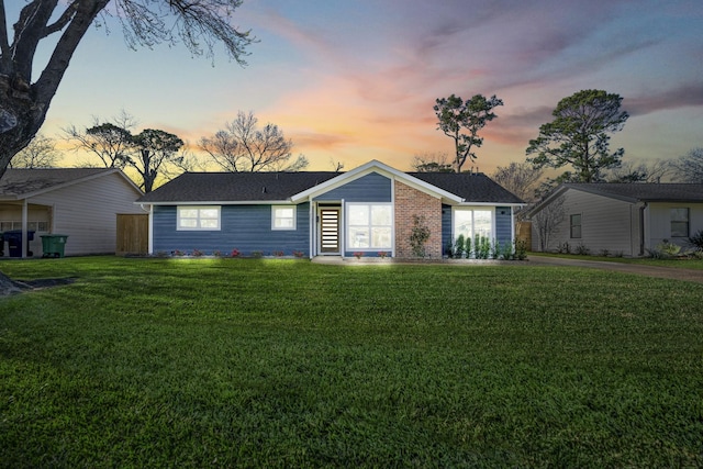 ranch-style house with a front yard