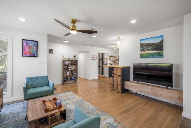 living room featuring recessed lighting, visible vents, wood finished floors, and a ceiling fan