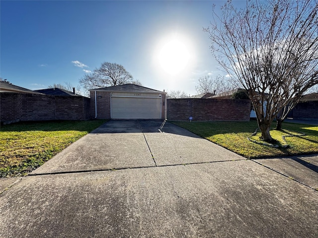 ranch-style home with a garage, driveway, a front yard, and fence