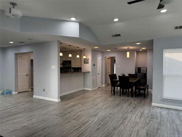 dining area featuring wood finished floors and visible vents