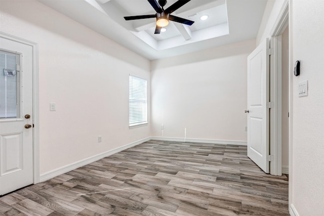 empty room featuring recessed lighting, baseboards, a ceiling fan, and light wood finished floors