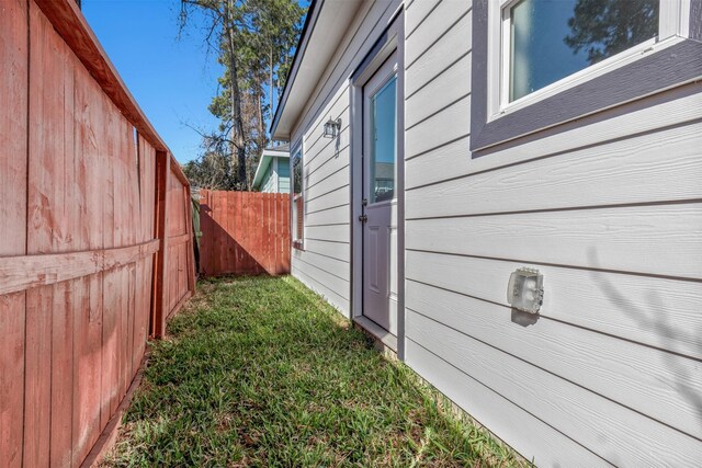 view of home's exterior featuring fence