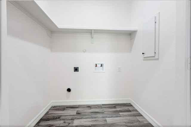 laundry room with baseboards, laundry area, hookup for a washing machine, hookup for a gas dryer, and electric dryer hookup