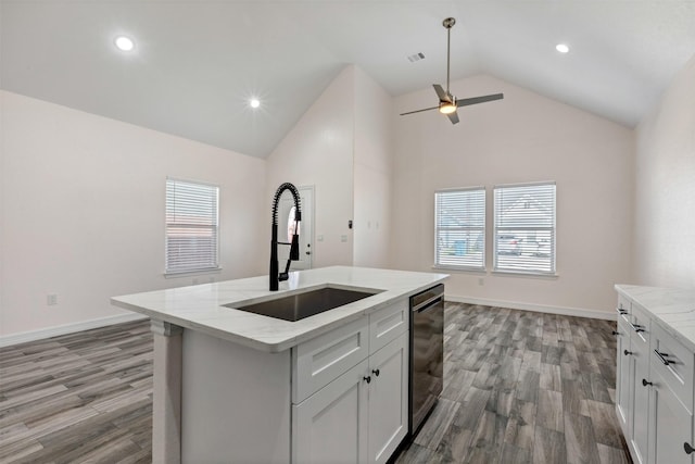 kitchen featuring a ceiling fan, visible vents, light stone countertops, a sink, and dishwasher