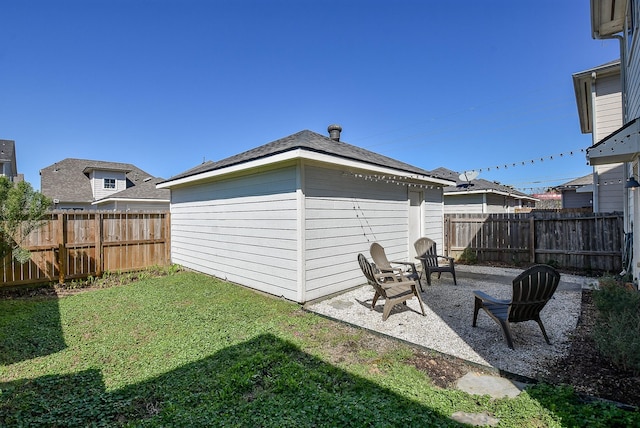 view of yard featuring a patio and a fenced backyard