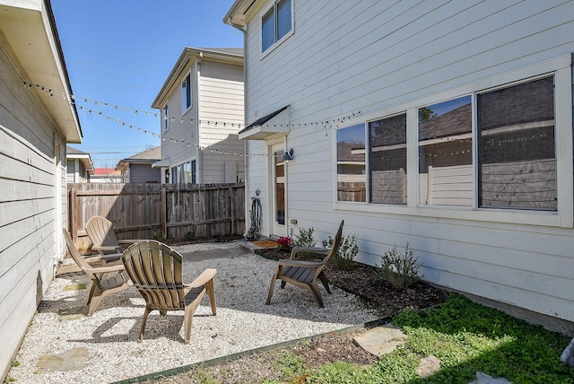 view of patio featuring fence