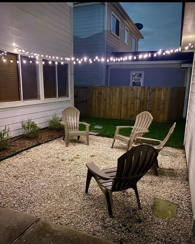 view of patio / terrace featuring fence