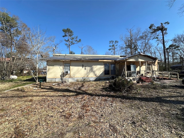 rear view of property with a porch