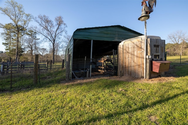 view of outbuilding with an outbuilding and fence