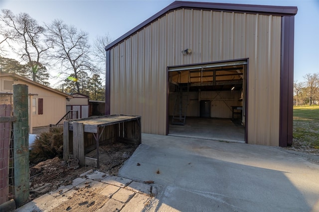 view of outbuilding featuring an outbuilding and concrete driveway