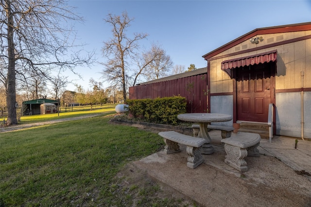 view of yard featuring a patio and fence