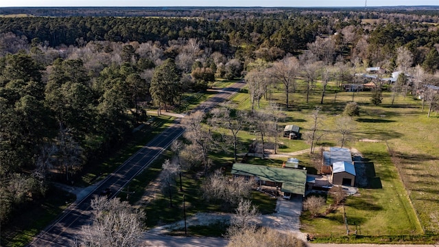 drone / aerial view featuring a rural view and a wooded view