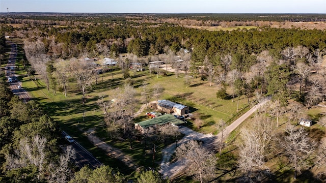 birds eye view of property with a forest view