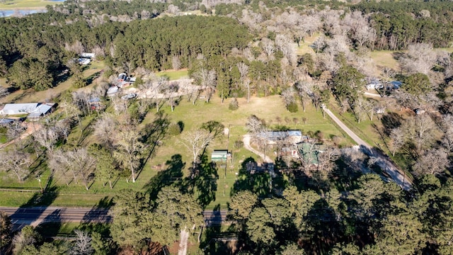 aerial view featuring a wooded view