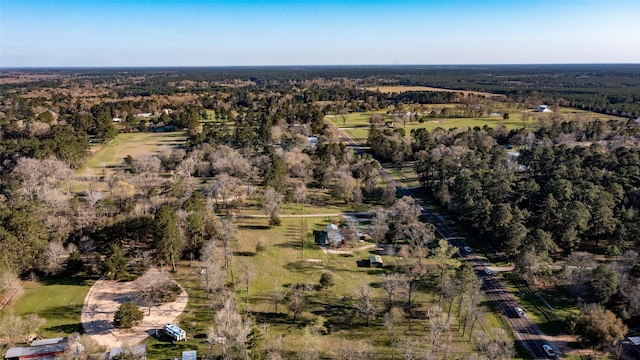 bird's eye view featuring a wooded view