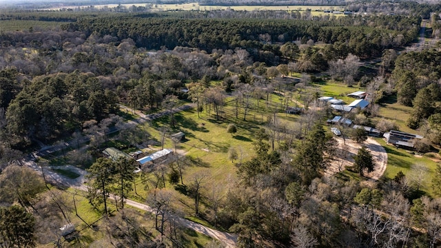 birds eye view of property with a wooded view